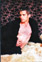 Scott in sheepskin coat and black pants