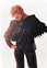 Toni Shannon in accordian sleeved leather and suede jacket and leather pants.